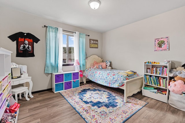 bedroom with wood-type flooring