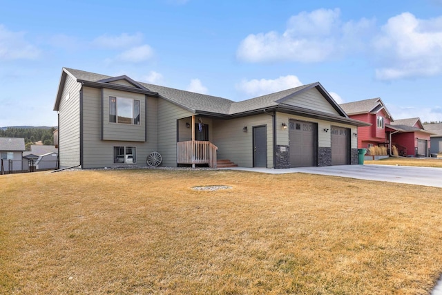 view of front of house with a front lawn and a garage