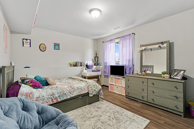 bedroom featuring dark hardwood / wood-style flooring