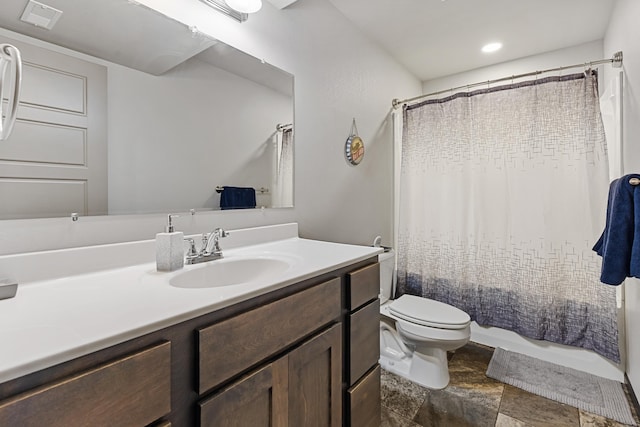 full bathroom featuring vanity, toilet, and shower / bathtub combination with curtain