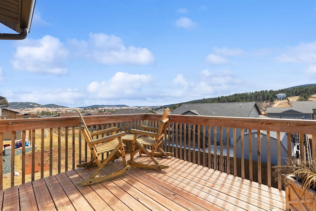 wooden terrace with a mountain view