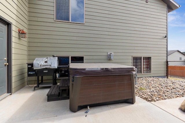 view of patio / terrace featuring a hot tub