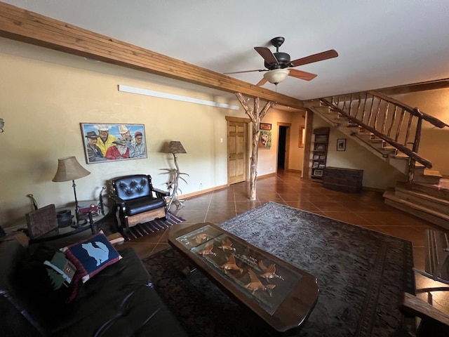 living room featuring dark tile patterned flooring and ceiling fan