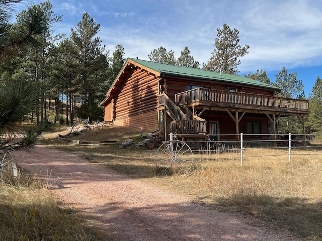 view of front of home featuring a wooden deck