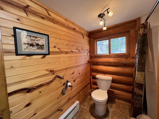 bathroom featuring tile patterned floors, toilet, and curtained shower