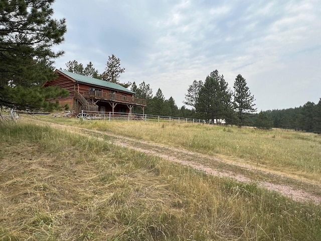 view of yard with a rural view