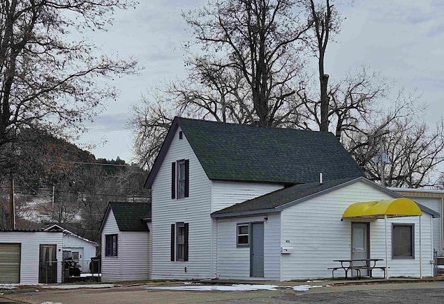 view of front of house with an outbuilding and a garage