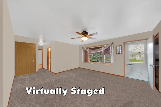 carpeted empty room with ceiling fan
