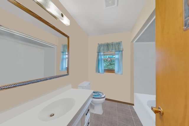 bathroom featuring tile patterned floors, vanity, toilet, and a tub