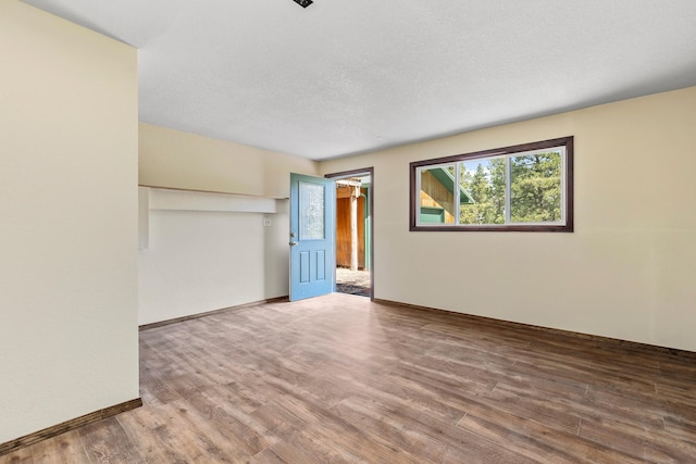 empty room with wood-type flooring