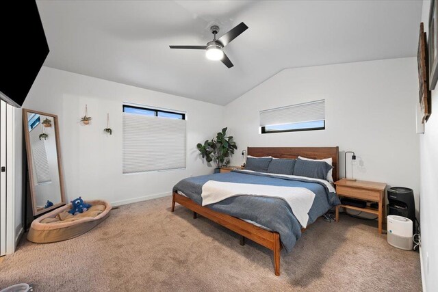 bedroom with carpet floors, vaulted ceiling, and ceiling fan