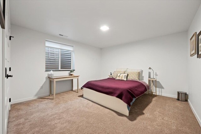 bedroom with light carpet