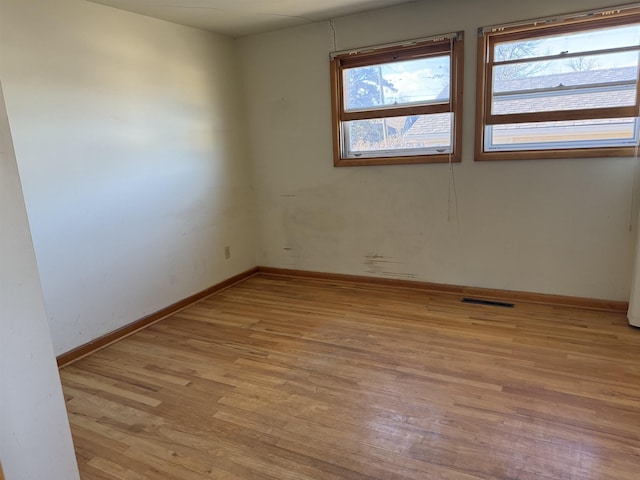 unfurnished room featuring light hardwood / wood-style floors