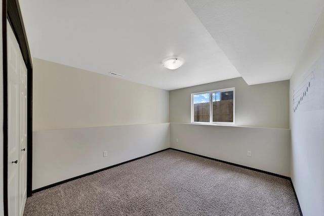 empty room featuring carpet flooring