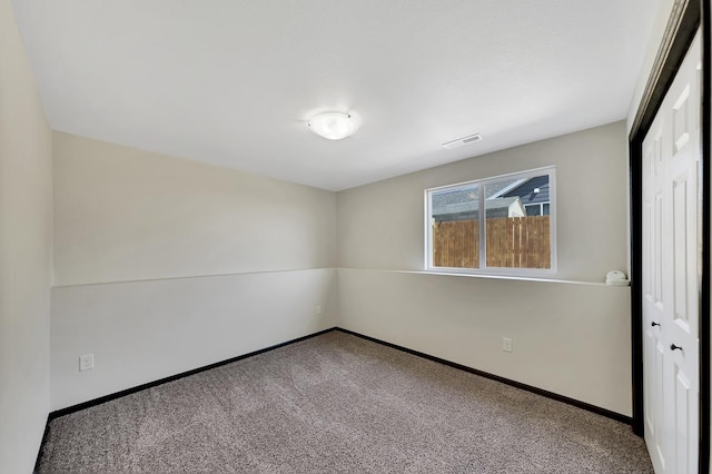 empty room featuring carpet floors