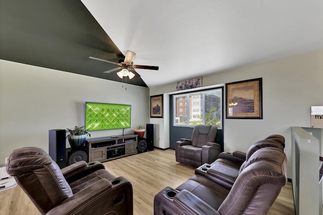 living room with ceiling fan and light hardwood / wood-style floors