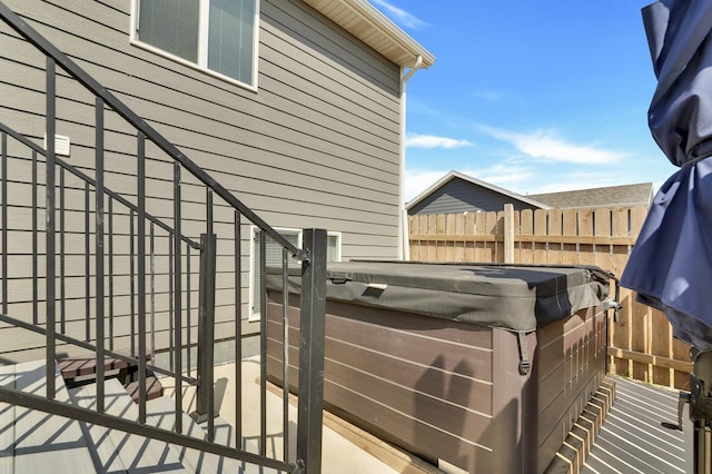 exterior space with a hot tub