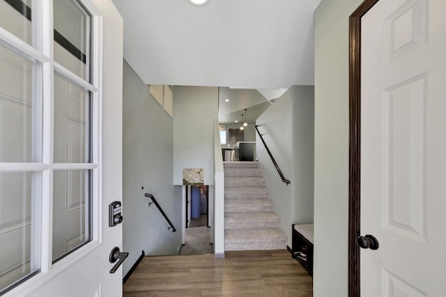 staircase featuring hardwood / wood-style flooring