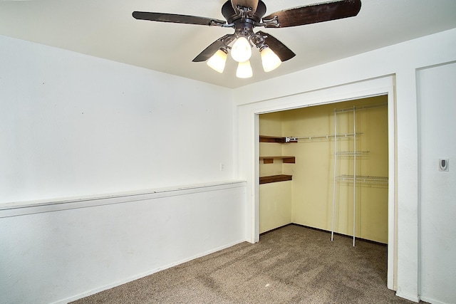 interior space featuring ceiling fan and carpet floors