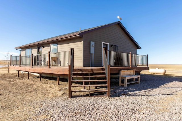 back of property featuring a wooden deck