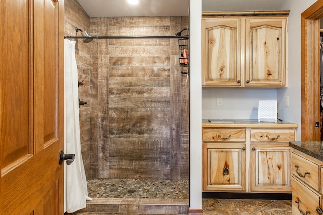 bathroom with vanity and walk in shower