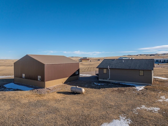 view of property exterior with an outdoor structure