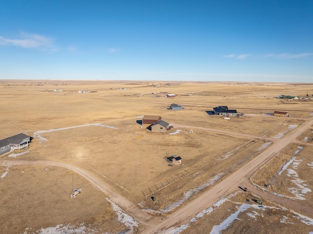 birds eye view of property with a rural view