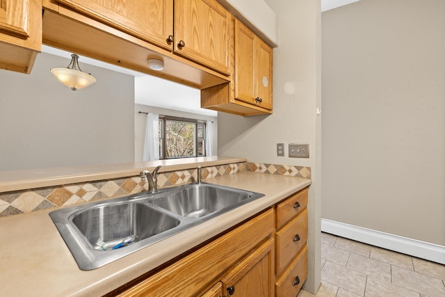 kitchen with light tile patterned floors and sink