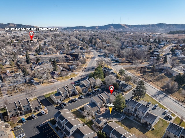 birds eye view of property featuring a mountain view