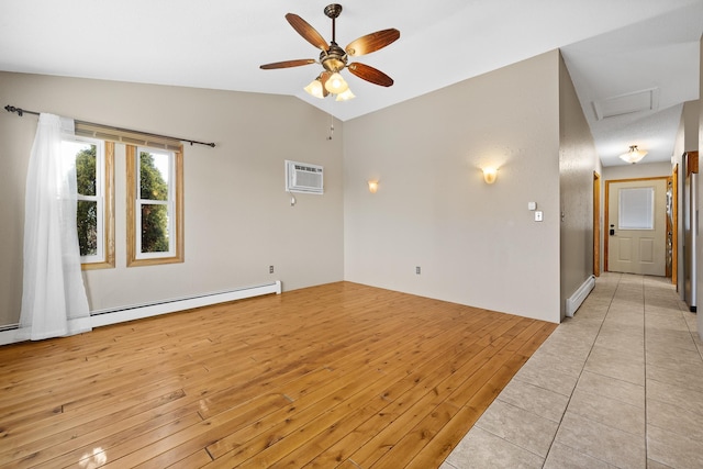 spare room with a wall mounted air conditioner, vaulted ceiling, ceiling fan, baseboard heating, and light hardwood / wood-style floors