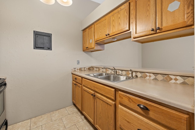 kitchen with sink and light tile patterned floors