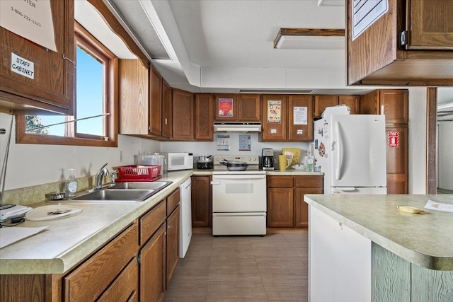 kitchen with sink and white appliances