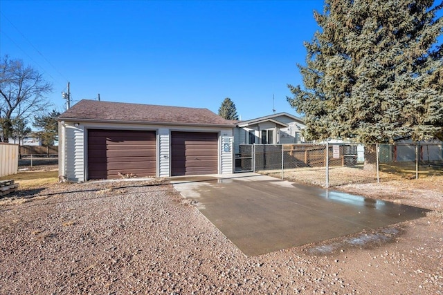 view of front of home featuring an outdoor structure and a garage