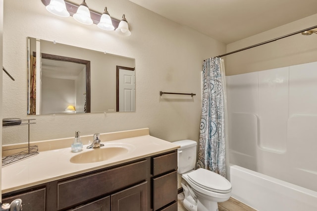 full bathroom with vanity, toilet, and shower / tub combo with curtain