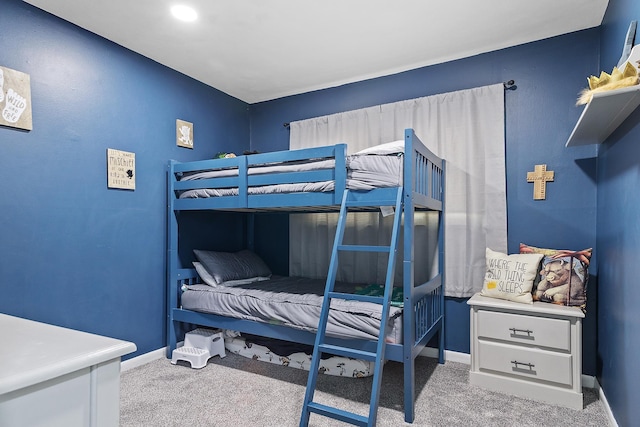 bedroom with light colored carpet