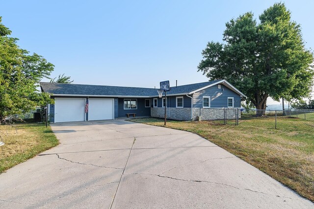 ranch-style home featuring a front yard and a garage