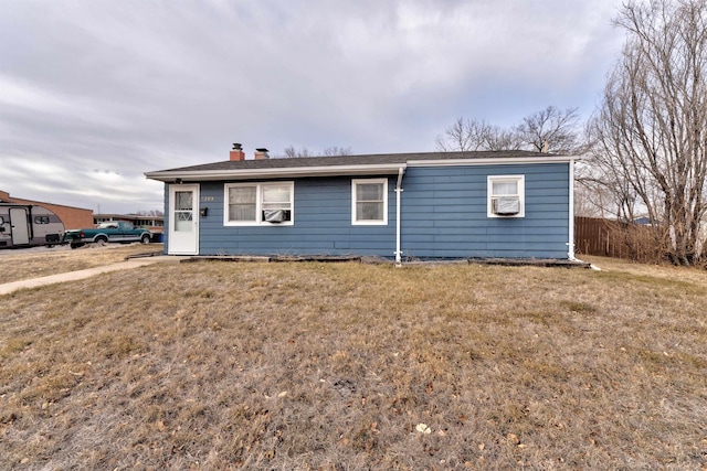 ranch-style house with a front lawn