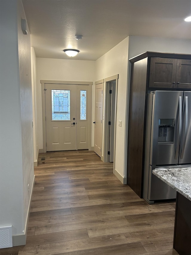 entrance foyer with dark hardwood / wood-style floors