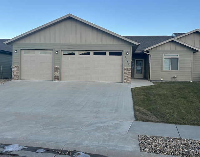 ranch-style home featuring a front yard and a garage