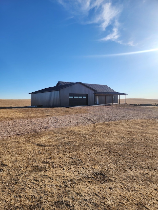 view of outdoor structure with a rural view