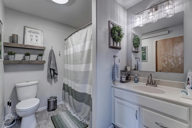 bathroom with a shower with curtain, vanity, and toilet