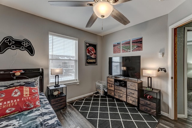 bedroom with ceiling fan and dark wood-type flooring