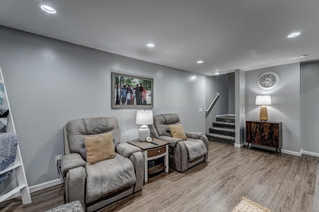 living area with hardwood / wood-style floors