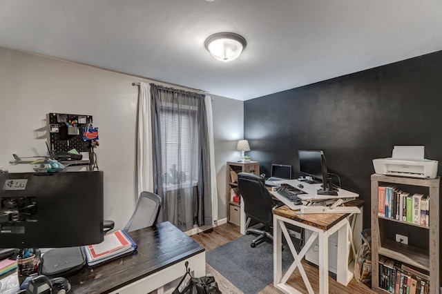 office space with wood-type flooring