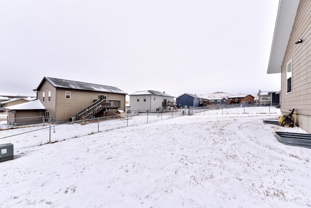 view of yard layered in snow