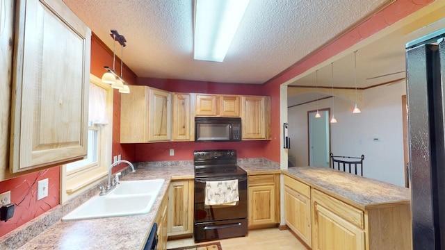 171 N Newton Ave, Hill City, SD 57745 - kitchen with black appliances, light brown cabinets, sink, and hanging light fixtures