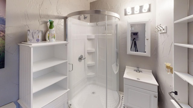 171 N Newton Ave, Hill City, SD 57745 - bathroom featuring vanity and a shower with shower door