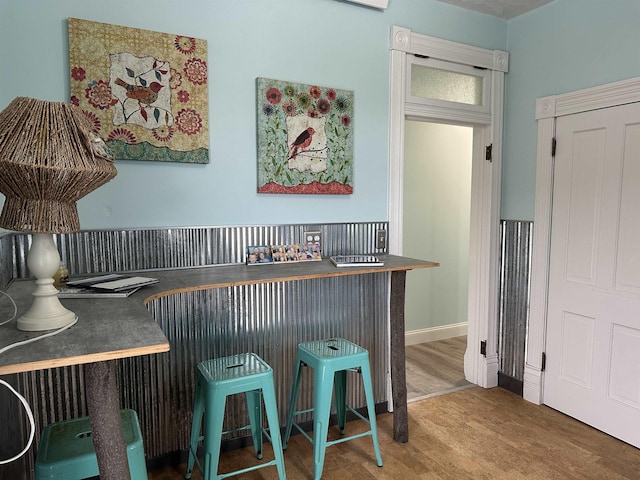 bar featuring hardwood / wood-style flooring