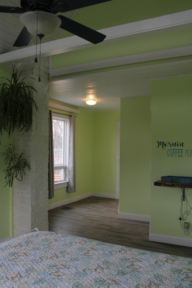 spare room featuring hardwood / wood-style flooring and ceiling fan