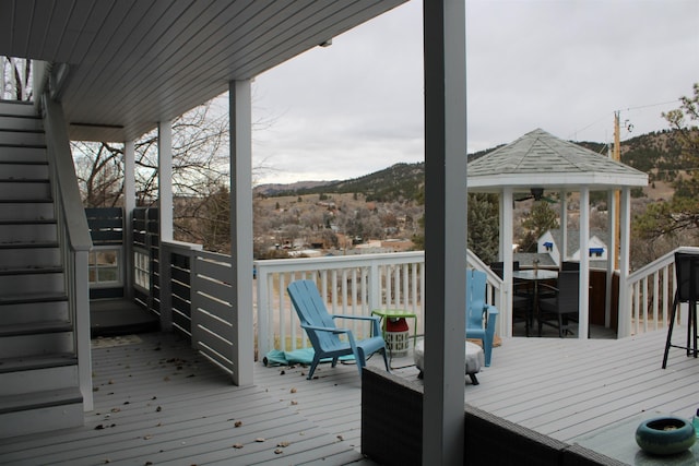 wooden terrace featuring a mountain view